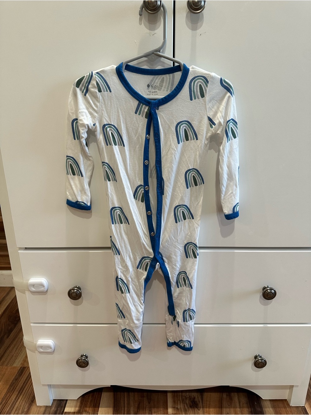 Kyte BABY White Footed Romper with Blue Trim and Teal Rainbow Print